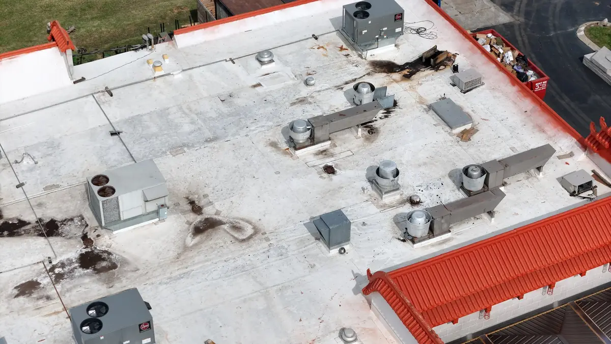 Aerial view of a commercial flat roof and rooftop units in Middle Tennessee by Blue Raider Roofing.