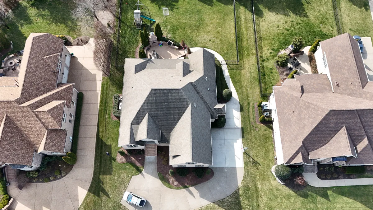 Aerial drone roof-inspection photo of a home in Brentwood, TN by Blue Raider Roofing