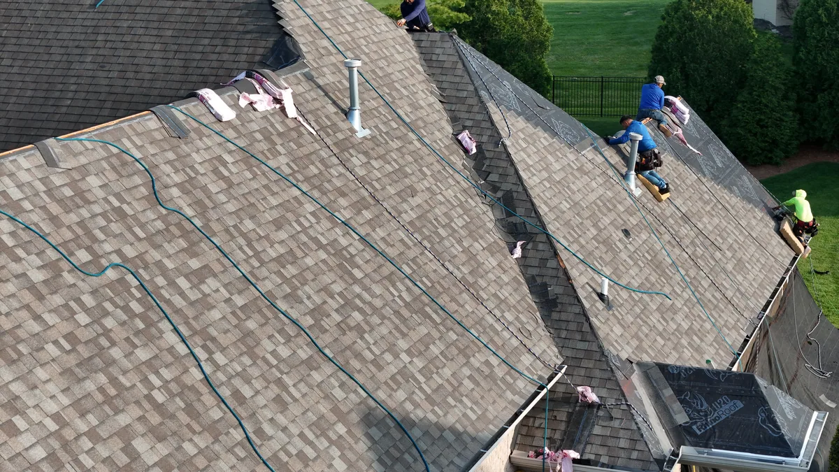 Roof work underway with materials staged on a Brentwood, TN home, April 14, 2026