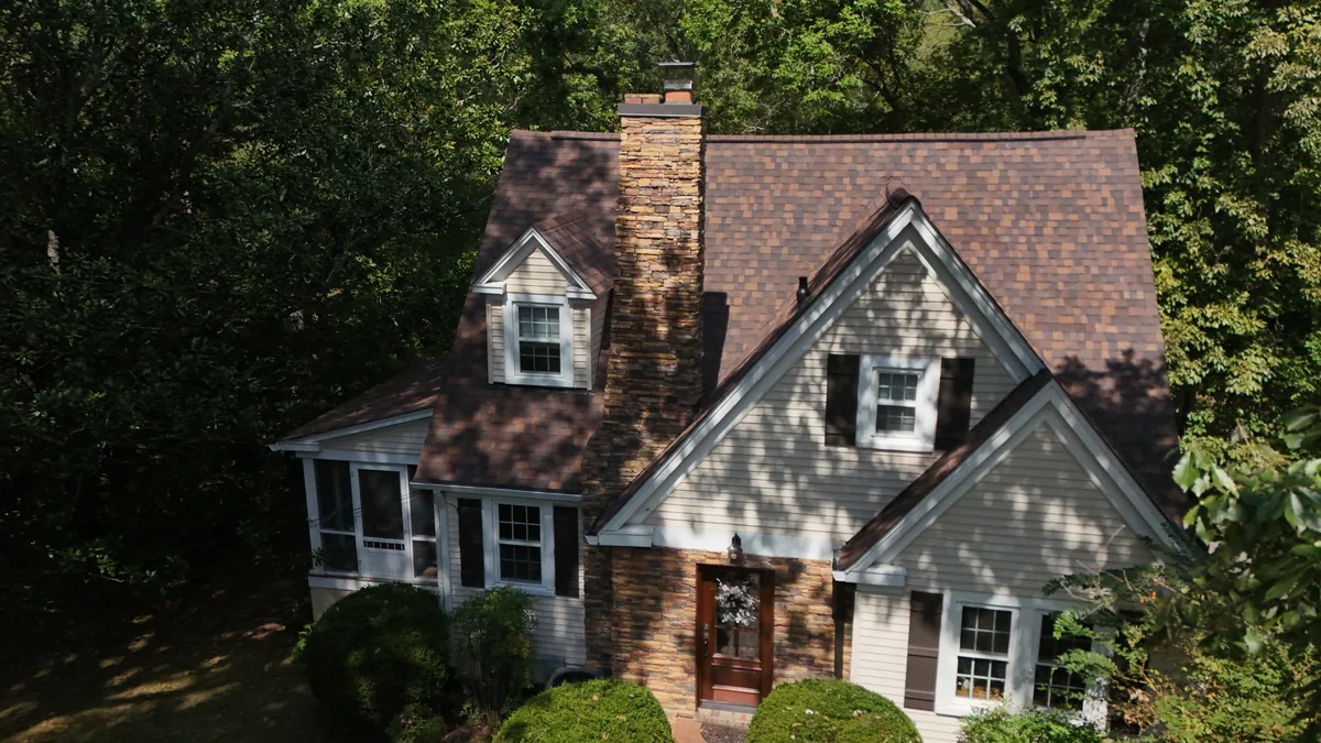 Completed roof on a stone-and-siding home in McMinnville, TN