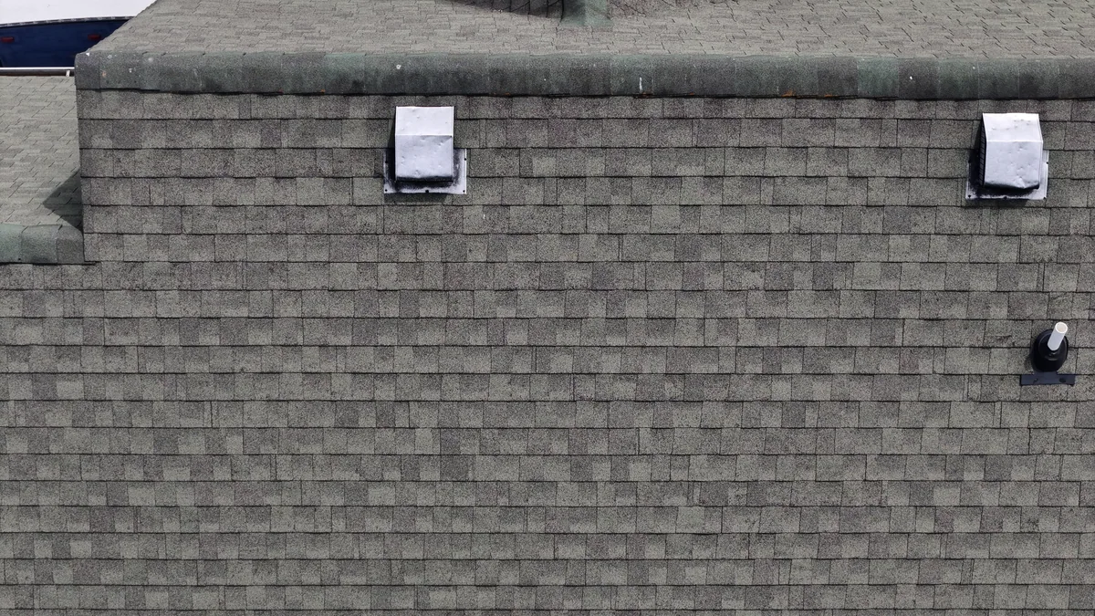 Ridge vents and pipe boot along a Murfreesboro, TN rooftop during inspection