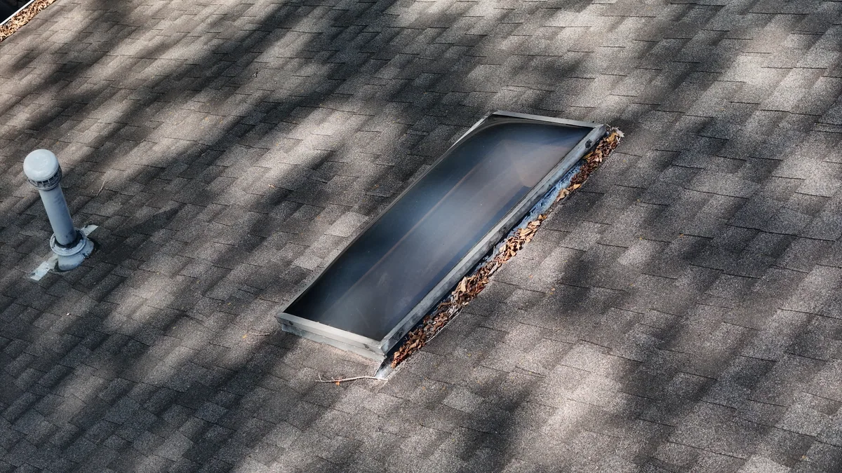 Drone close-up of a skylight with debris buildup found during a Nashville, TN roof inspection