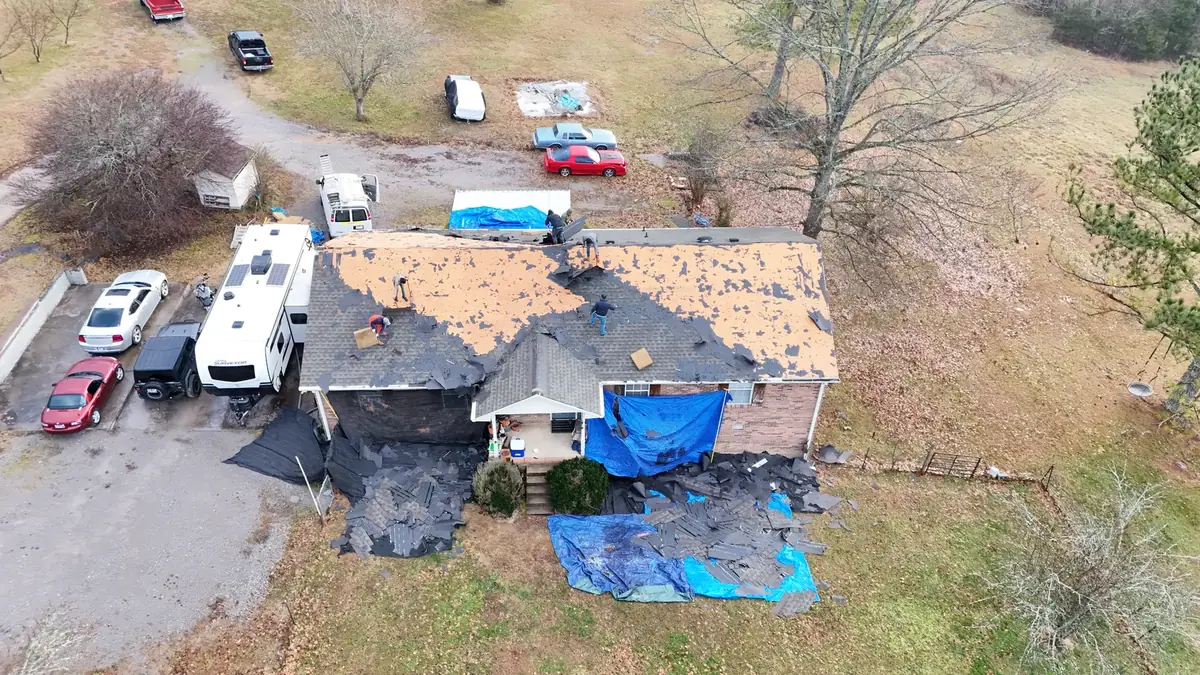 Aerial drone roof-inspection photo over Brush Creek, Tennessee by Blue Raider Roofing & Contracting