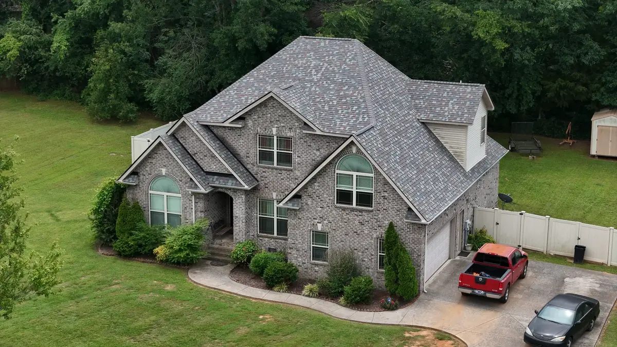 Aerial drone roof-inspection photo over Walterhill, Tennessee by Blue Raider Roofing & Contracting