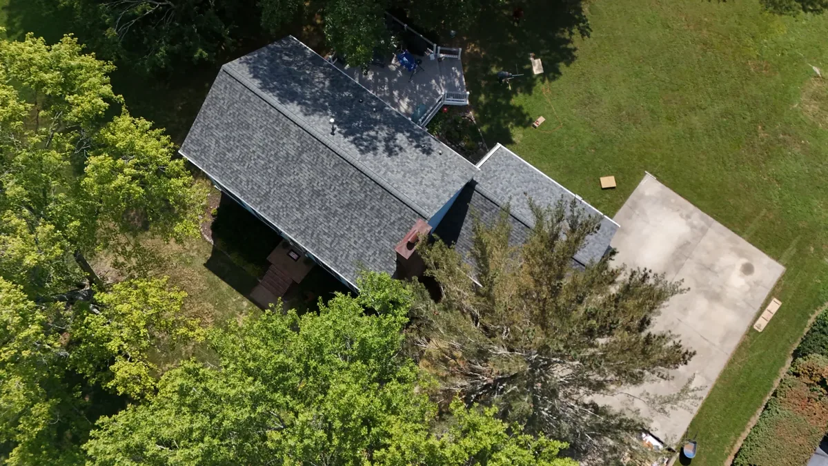 Roofers at work on a residential roof in Tullahoma, TN