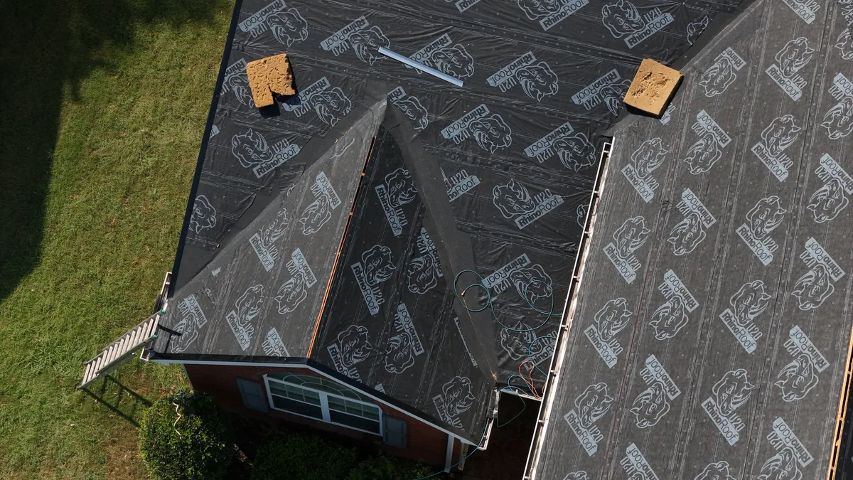 Roof slope covered in synthetic underlayment on a Smyrna, TN home mid-replacement