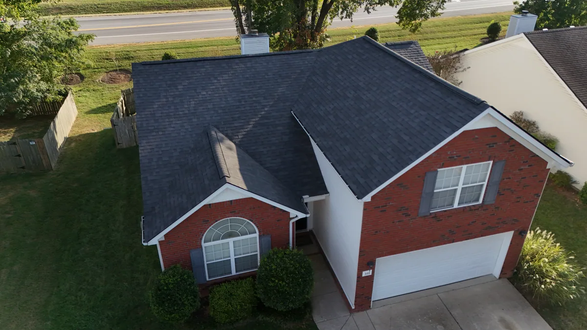 Completed architectural shingle roof on a red-brick Smyrna, TN home, evening of the same day
