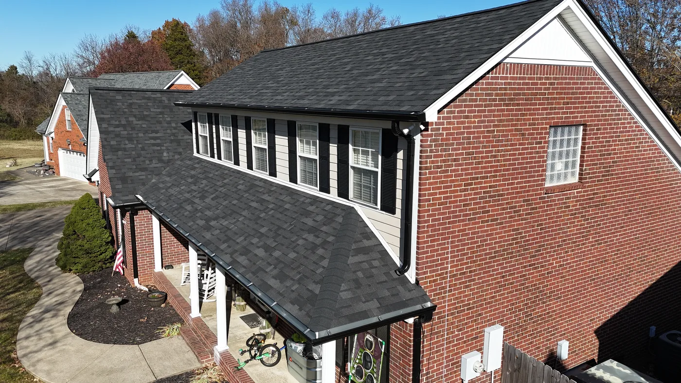 New seamless gutters and downspouts on a completed Blue Raider project