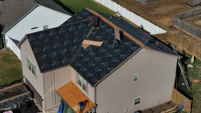 Our crew installing synthetic underlayment